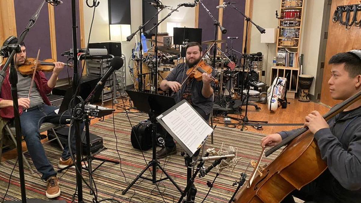From left to right: Chuck Callahan (violin); Patrick Monnius (viola); Caleb Yang (cello)